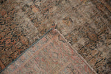 Distressed vintage Hamadan carpet showcasing exposed foundation, hand-knotted back, and detailed selvage.