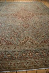 Distressed vintage Kashan rug with dusty blue, wine red floral patterns, and foundation knots.