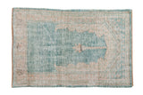 Vintage distressed Oushak rug with a unidirectional prayer design in soft ocean green-blue and time-softened cream.
