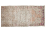 Vintage distressed Oushak runner, worn pile, muted ivory, beige, and pink tones. 2'11