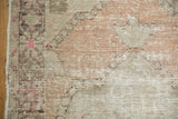 Distressed vintage Oushak runner texture: worn pile, exposed foundation, soft beige, ivory, dusty blush.