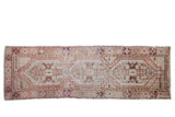 Distressed vintage Oushak runner, pale coral and blue geometric medallions with stepped perimeter, 2'6
