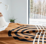 Stacey Garcia knit throw with tan, black, and cream architectural arch pattern.