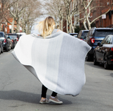 Eco-Friendly Made in USA ombre gray throw blanket displaying knit texture and graduated stripes.