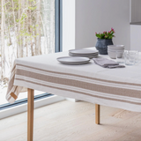 Woven French stripe tablecloth in off-white with wide, textured brown herringbone stripes.
