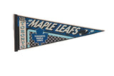 A vintage Toronto Maple Leaves felt pennant with classic blue and white team graphics.