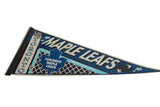 Vertical TORONTO text and NHL logo on the stitched black hoist of a vintage felt pennant.
