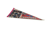 Vintage Chicago Bulls pennant with player caricatures, pink felt edge, and tip curl.