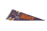 Vintage felt Chicago Bears pennant, purple with orange helmet logo and lettering, exhibiting subtle age creases.