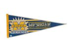 Vintage Michigan Wolverines blue and yellow felt pennant with 'M' logo and starburst design, 12x30.