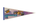 A vintage 1990s Indianapolis 500 felt pennant with a yellow race car and purple checkered graphic.