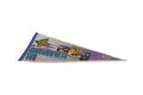 The entire vintage Indianapolis 500 felt pennant, highlighting its blue felt border and full-color race car graphic.