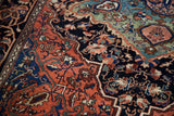 Rich coral border with royal blue and seafoam abrash, intricate antique Persian motifs.