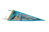 Full length view of the Johnson Space Center pennant at an angle, showing its vintage graphics.