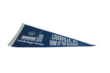 Angled view of the vintage Louisville Slugger Museum pennant showing its printed graphics.