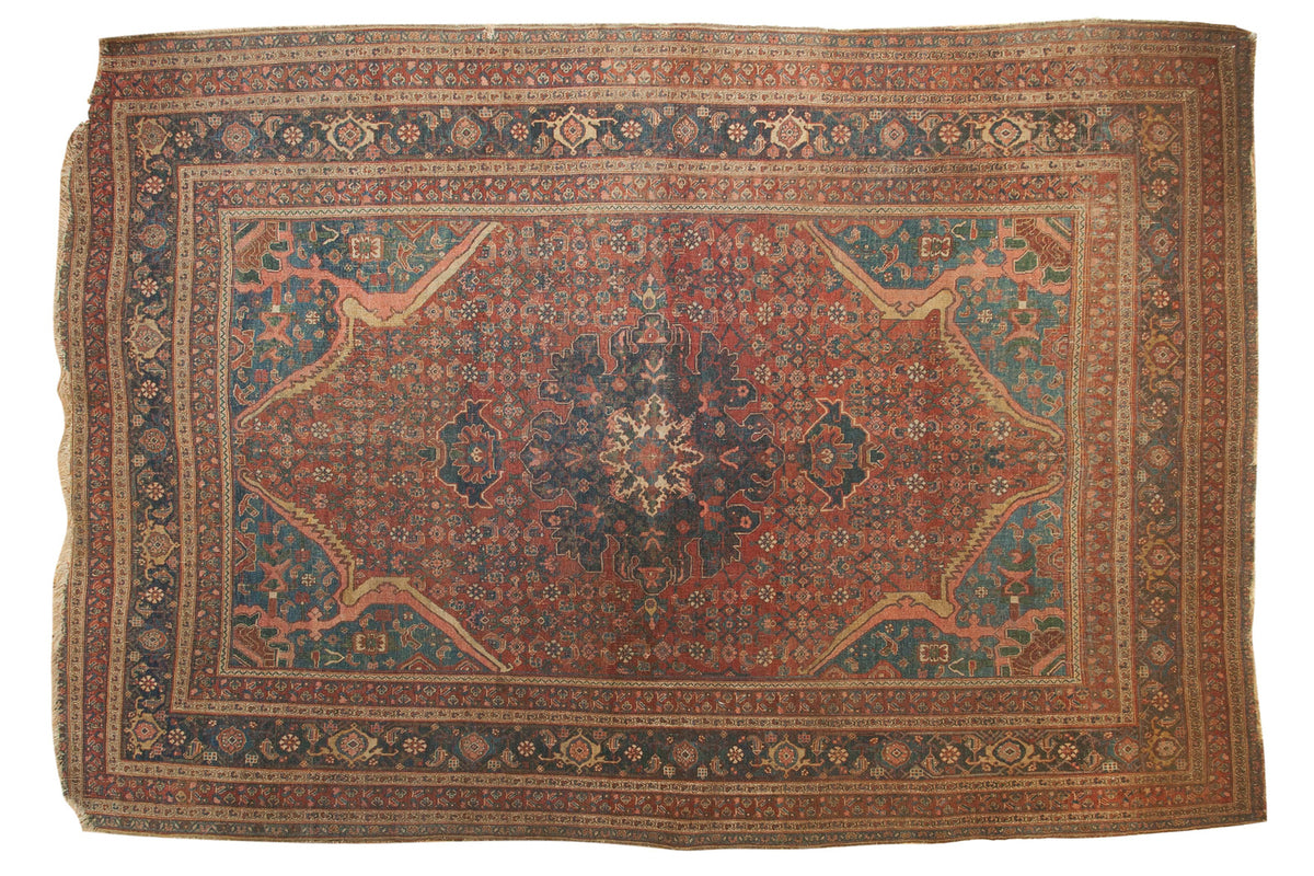 Stunning antique Persian Bijar rug with a bold central medallion and sprawling arabesques in rich red and blue tones.