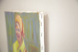 Detailed side view of the vintage painting's stapled canvas construction.