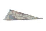 Angled view of a vintage Wildcats pennant showing its faded purple felt and aged patina.