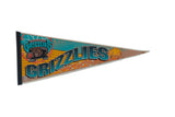 Vintage Vancouver Grizzlies felt pennant with teal, yellow, brown bear, and star design, 12