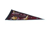 Vintage Chicago Bulls felt pennant with classic yellow horn and team logo graphics.