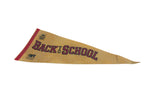 Left side of vintage felt pennant, showing red trim, film logos, and partial 'Back to School' text.