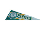 Vintage Boston Celtics felt pennant: leprechaun logo on green and white felt, with yellow accent.