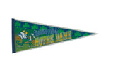 Notre Dame Fighting Irish vintage felt pennant with a green and blue design, leprechaun mascot, and shamrocks.