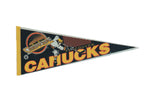 Vintage Vancouver Canucks felt pennant in black with yellow, orange, white logo, 12x30.