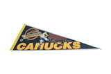 Vancouver Canucks felt pennant displaying black, orange, and white hockey player graphic.