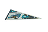 Vintage Jacksonville Jaguars felt pennant with black stitched edge and teal team logo.