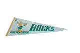 Milwaukee Bucks felt pennant, circa 1990s, with classic deer mascot and bold green text.