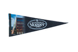 Black Louisville Slugger felt pennant with a city scene and baseball bat graphic.