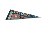 Vintage Montreal Canadiens felt pennant displaying its classic red and blue hockey graphics.