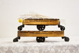 Two mini industrial carts stacked, displaying their torched pine finish and black casters.