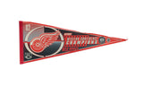 A vintage 2002 Detroit Red Wings Stanley Cup Championship felt pennant in red, black, and white.