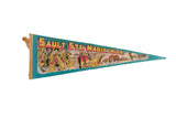 Sault Ste. Marie, Michigan vintage felt pennant with a yellow and red landmark illustration on a teal background.