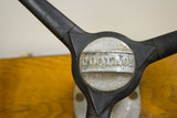 Vintage boat helm wheel center with DUOTROL logo and visible rubber splits.