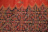 Detail of the sawtooth border and dark blue Herati motif on a 4x6 antique Malayer rug.