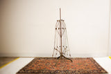 Ultra industrial metal dress form, late 19th century, with collapsible frame and patina.