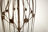 Close-up of heavily rusted metal rods and joints on the industrial skirt form.