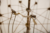 Patinaed industrial metal frame with original cloth measuring tape.