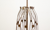 Antique industrial metal dress form, rusty patina, with original cloth measuring tape.