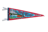 Vintage red Mackinac Bridge Michigan pennant with a colorful sunset and sailboat graphic.