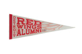 Signed vintage Detroit Red Wings Alumni felt pennant with red block lettering and faint logo graphic.