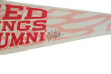 Close-up of the black ink signature on the Red Wings Alumni felt pennant.