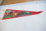 Vintage Wisconsin Dells pennant laid out flat, displaying its full length and scenic graphic.