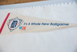 Vintage Detroit Tigers pennant highlighting the team logo and WJR radio graphic.