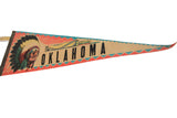 Close-up detail of the vintage chief graphic on the Oklahoma felt pennant.