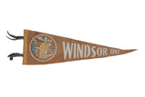 Vintage Windsor Ontario felt pennant in brown with a circular graphic of a moose by a lake.