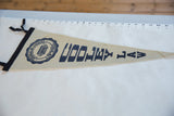 Cream felt Cooley Law pennant, vintage 1980s, with dark blue graphics.